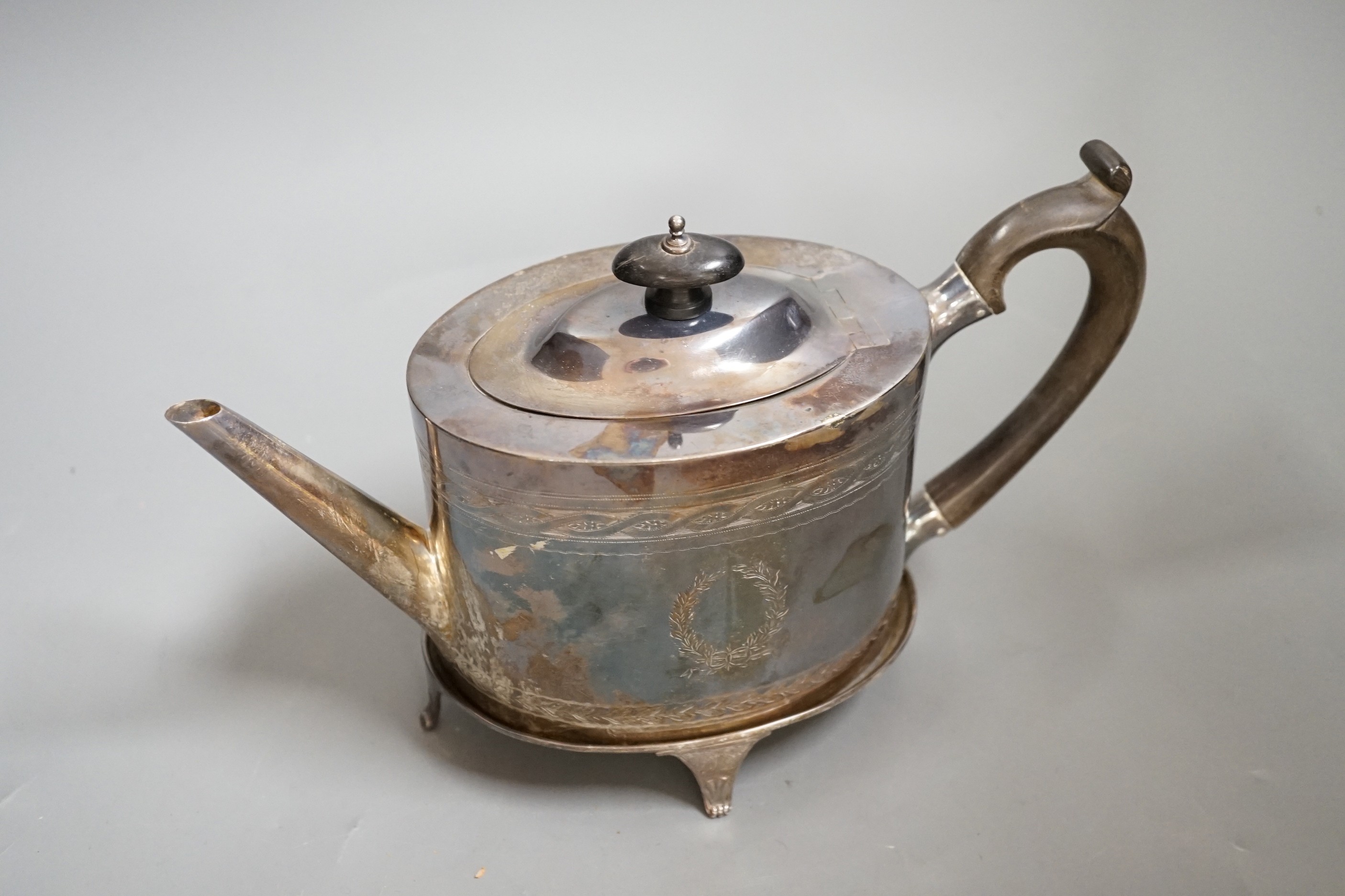 A George V 18th century style silver oval teapot on stand, by Elkington & Co, Birmingham, 1911